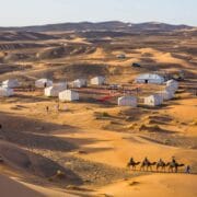 A stay at a Morocco Desert Luxury Camp is more than just accommodation; it’s an all-encompassing experience. By day, ride camels or quad bikes across the dunes,